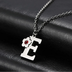 Collar con colgante de inicial y flor e