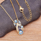 Collar con colgante de lengua ojo azul y circonio