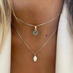 Collar doble con colgante Ojo Azul Turco y Mano de Fátima en plata