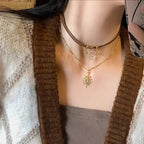 Collar Doble Colgante Sol