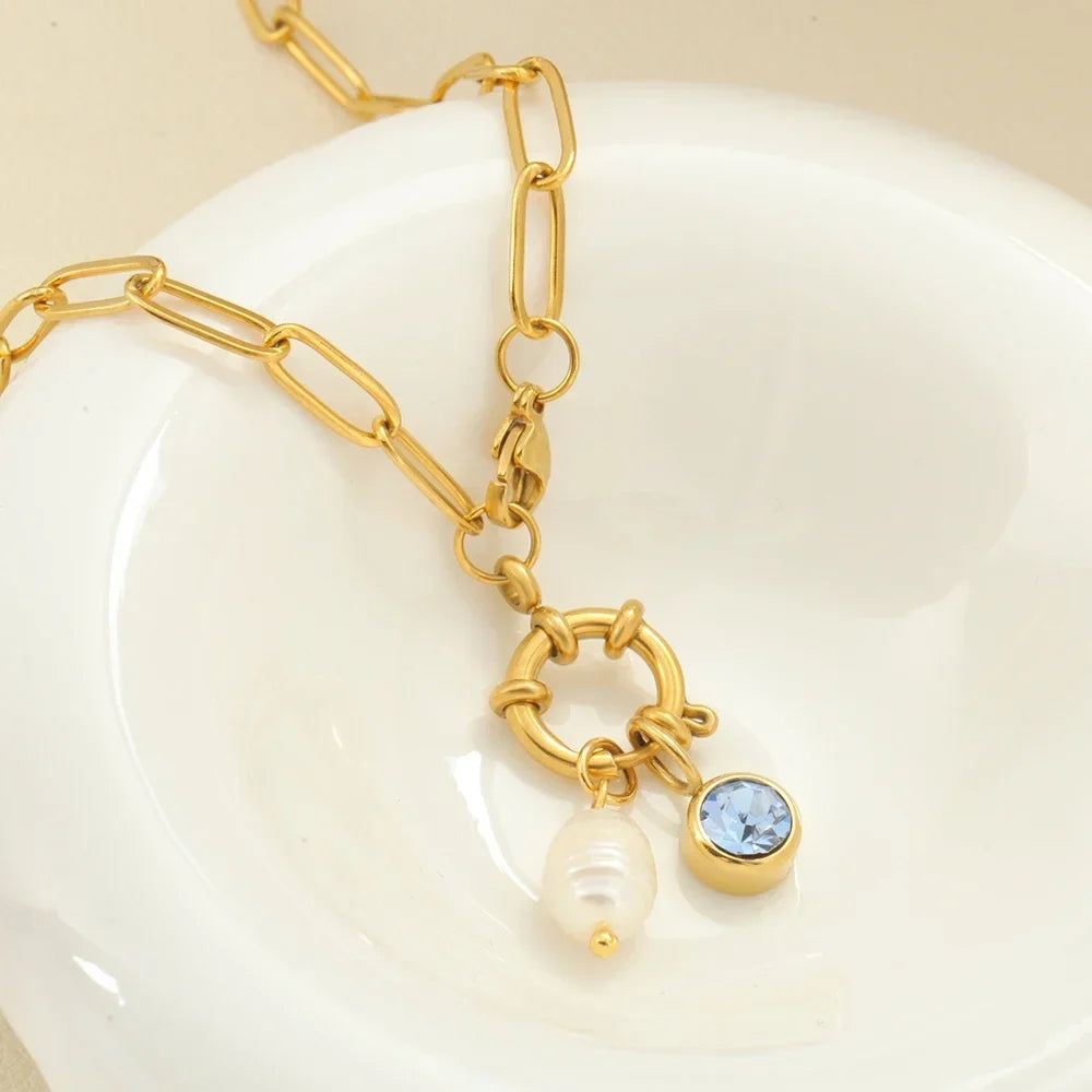 Collar de eslabones con dije de perla y piedra natal de abril