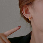 Aretes colgantes finos en forma de gota de agua oro