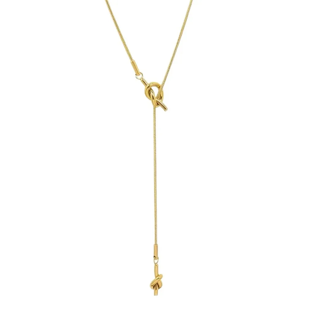 Collar tipo gargantilla con colgante de moño diseño oro