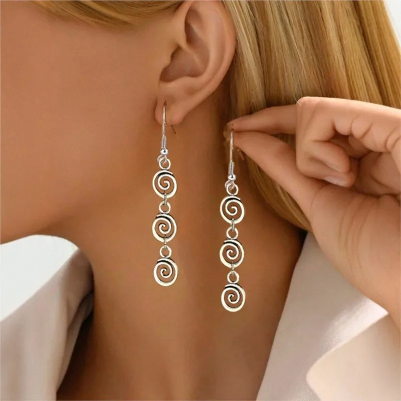 Aretes largas colgantes de espiral