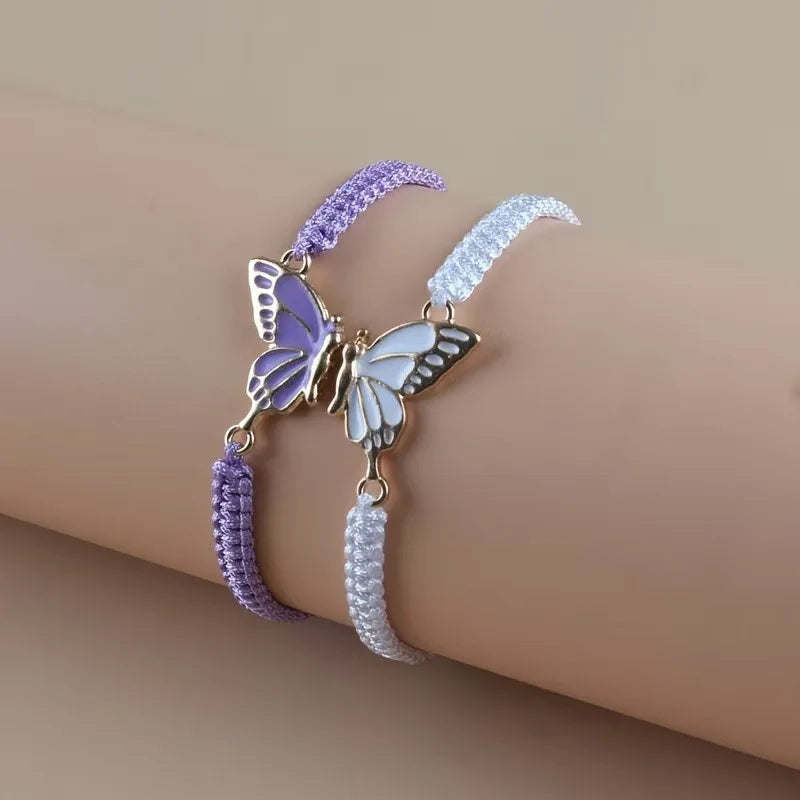 Juego de 2 Pulseras Ala de Mariposa para Mejores Amigos morado y blanco