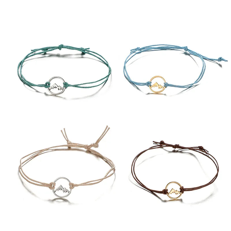 Lote de 4 pulseras de cuerda con colgante redondo de montaña