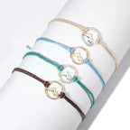 Lote de 4 pulseras de cuerda con colgante redondo de montaña
