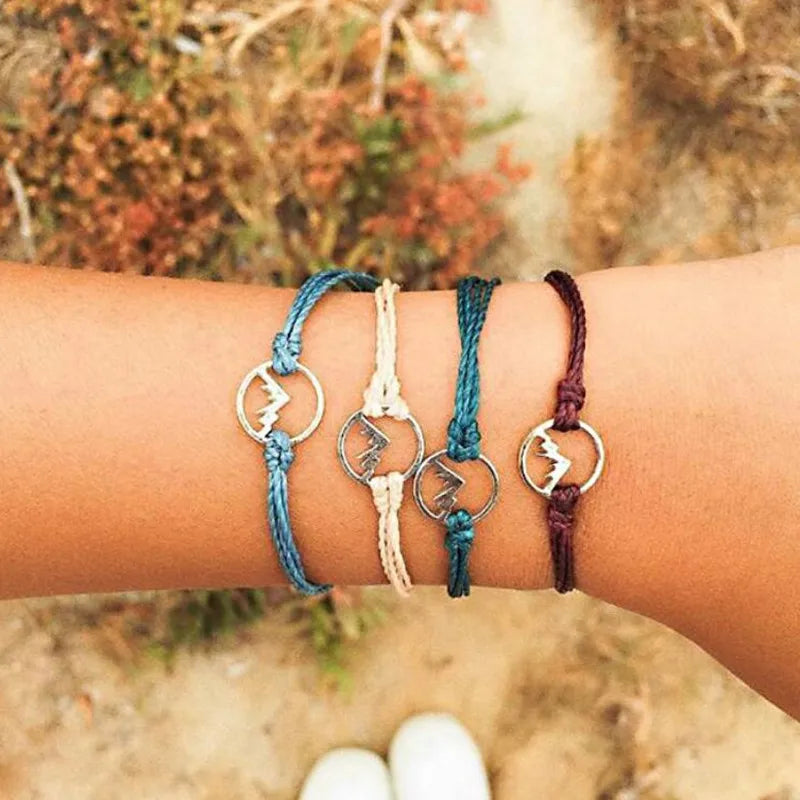 Lote de 4 pulseras de cuerda con colgante redondo de montaña