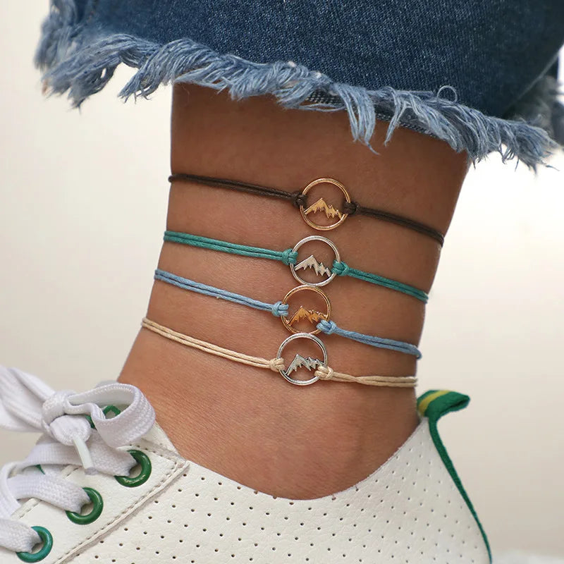 Lote de 4 pulseras de cuerda con colgante redondo de montaña